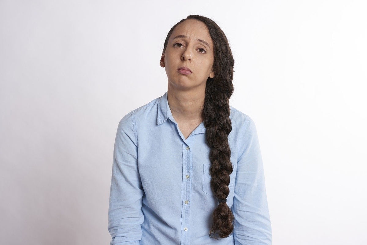 A woman with a sad expression